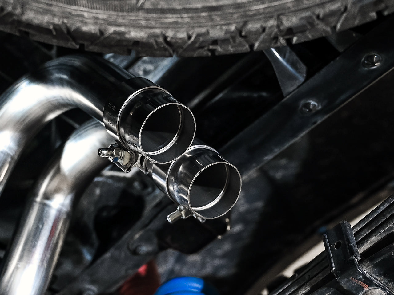 AWE 0FG Exhaust with BashGuard for 3rd Gen Tacoma - Dual Chrome Silver Tips - Close Up