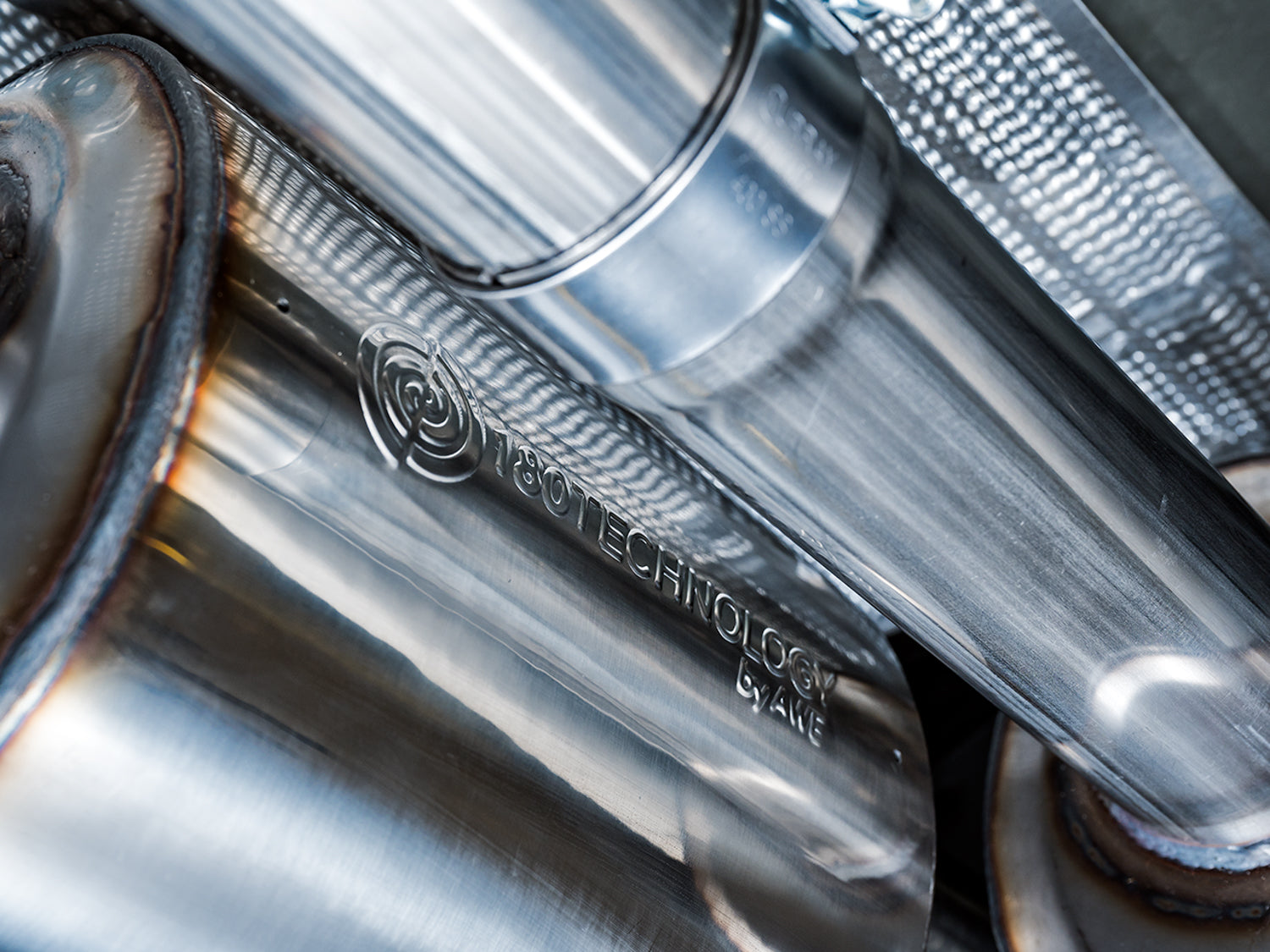 AWE 0FG Catback Split Rear Exit Exhaust for 4th Gen Silverado/Sierra 1500 6.2L (with bumper cutouts) - Quad Chrome Silver Tips - Close Up