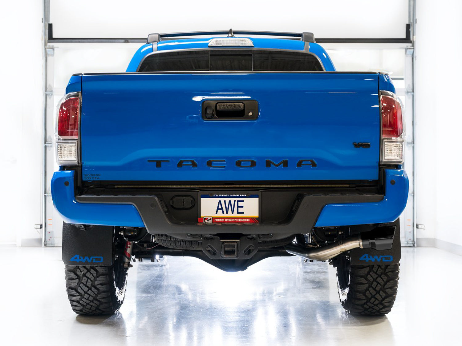 AWE 0FG Exhaust with BashGuard for 3rd Gen Tacoma - Dual Diamond Black Tips - out of package