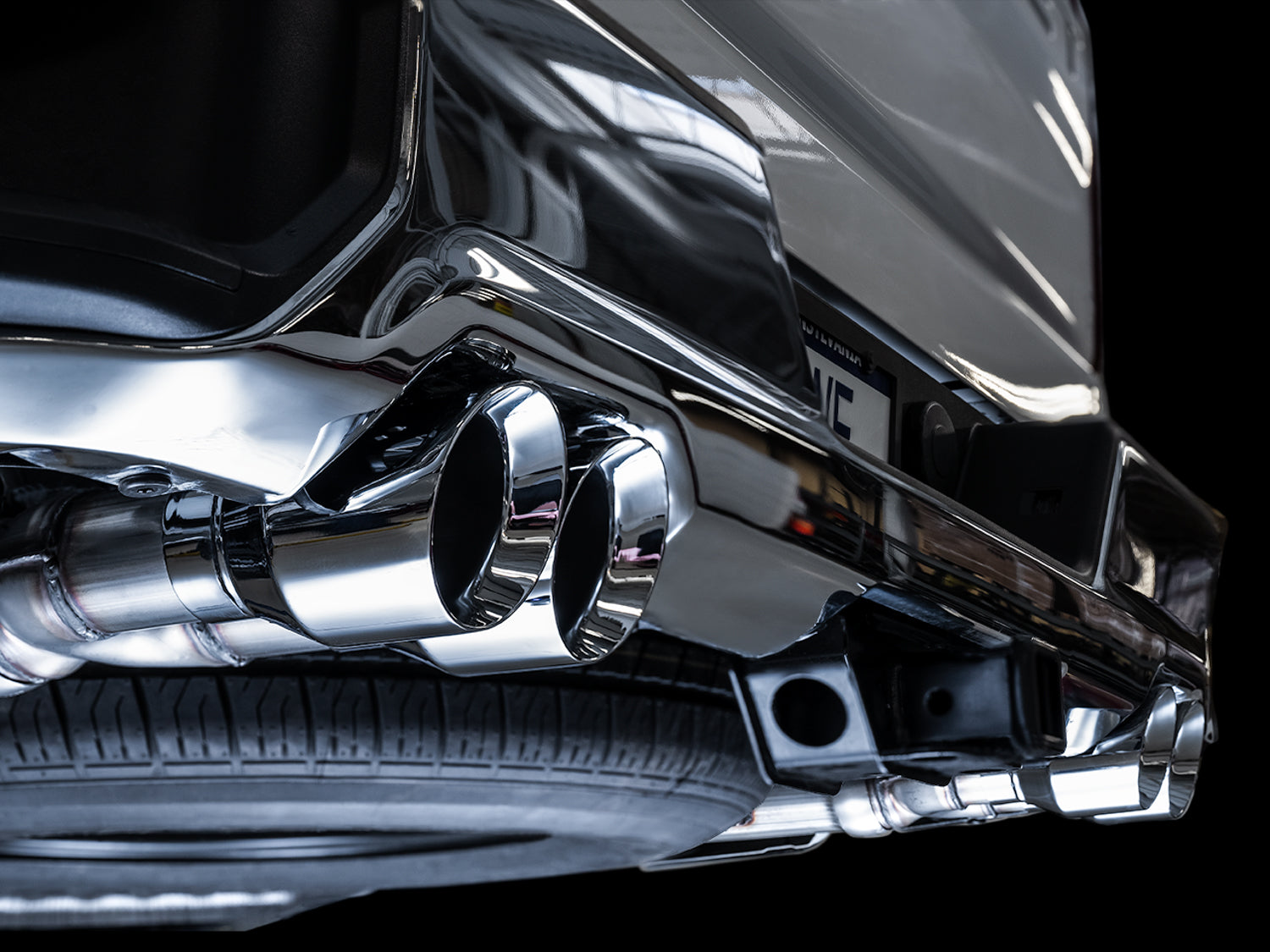 AWE 0FG Catback Split Rear Exit Exhaust for 4th Gen Silverado/Sierra 1500 5.3L (With Bumper Cutouts) - Quad Chrome Silver Tips - Mounted