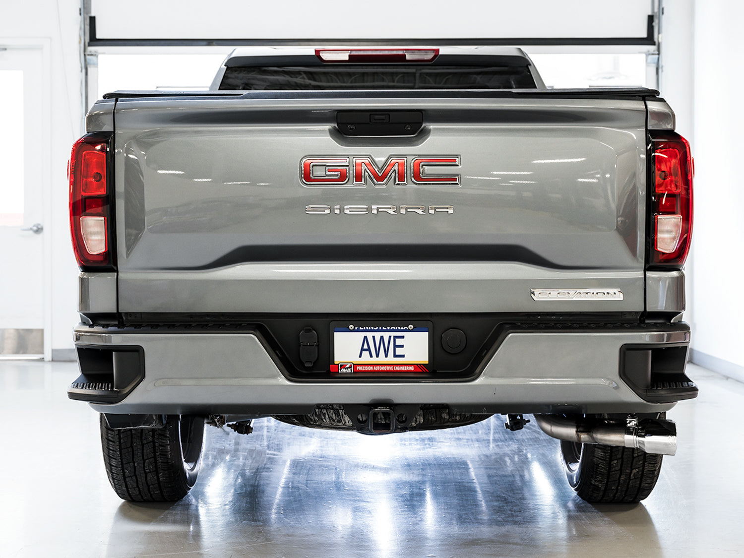 AWE 0FG Catback Dual Side Exit Exhaust for 4th Gen Silverado/Sierra 1500 5.3L (Flat Bumper) - Chrome Silver Tips - Mounted